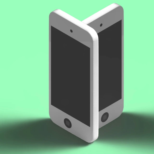 a white and gray phone sitting on top of a green background