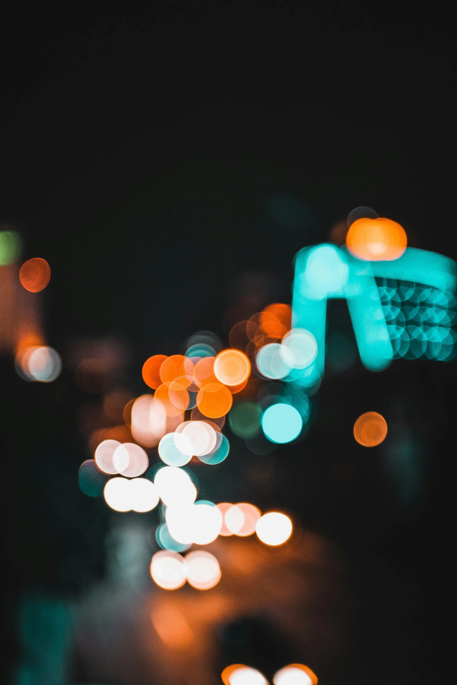 blurred blurry pograph of street lights on city streets