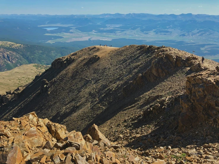 there is a rocky mountain with a view over it