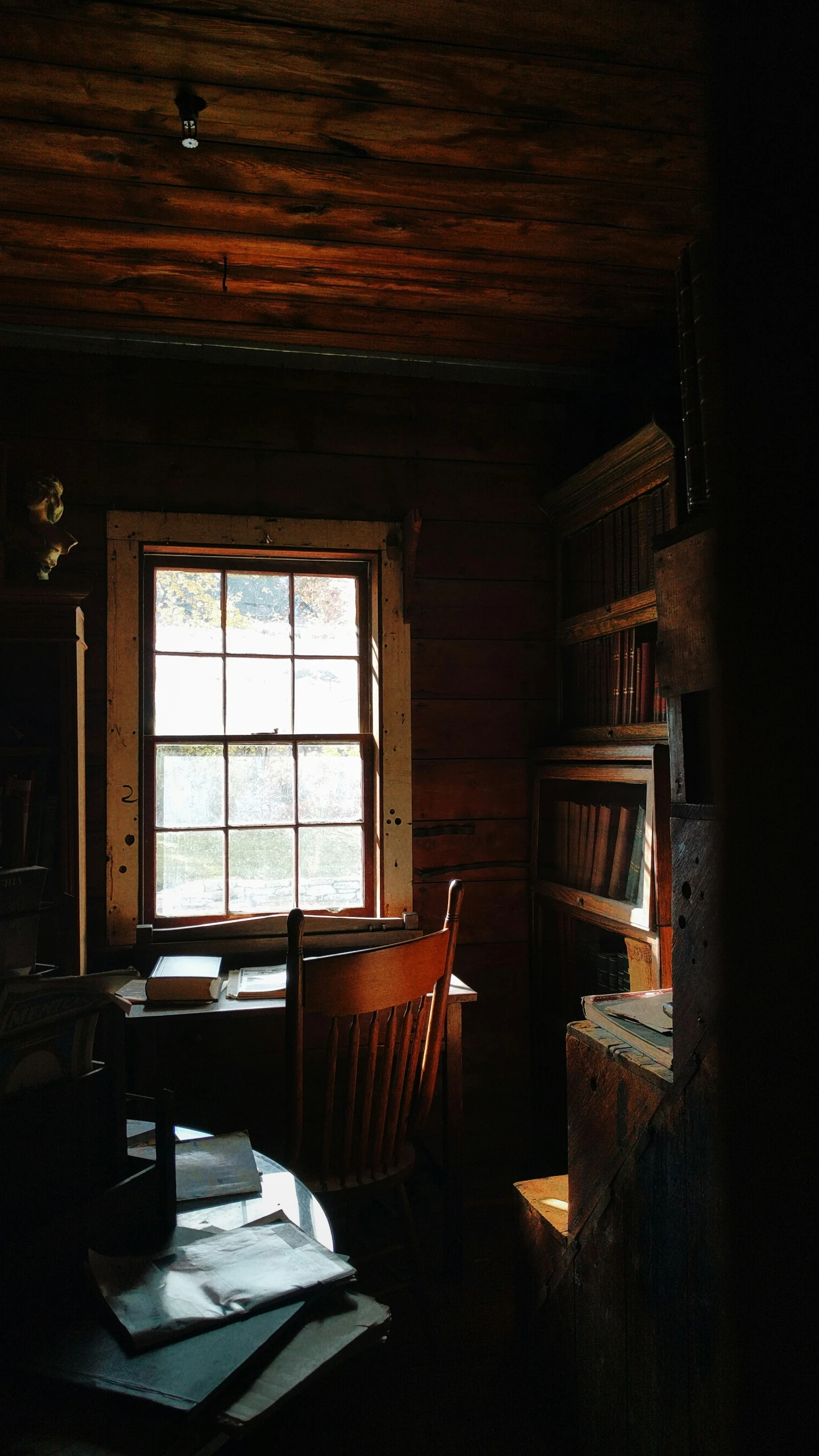 a dimly lit desk in the dark room