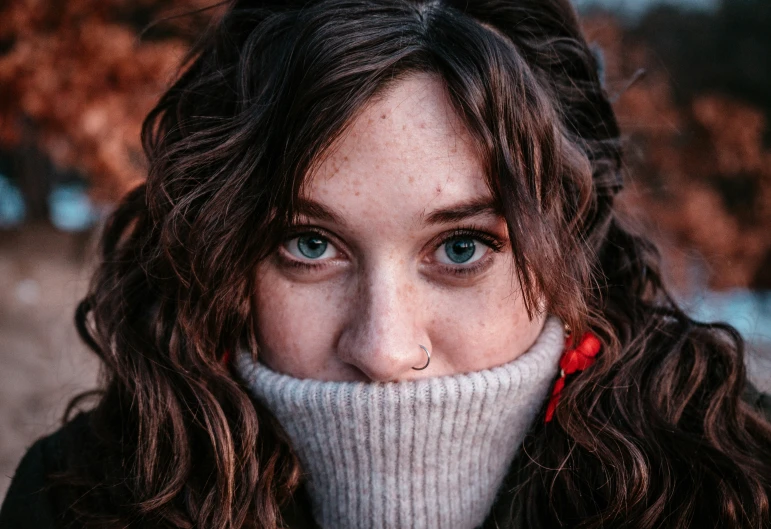 a girl with her nose partially wrapped around herself