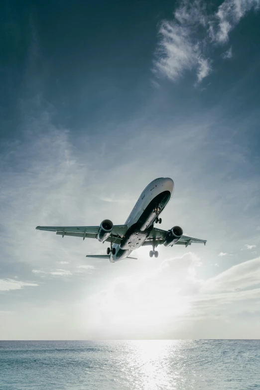 a large passenger jet flying through a blue sky