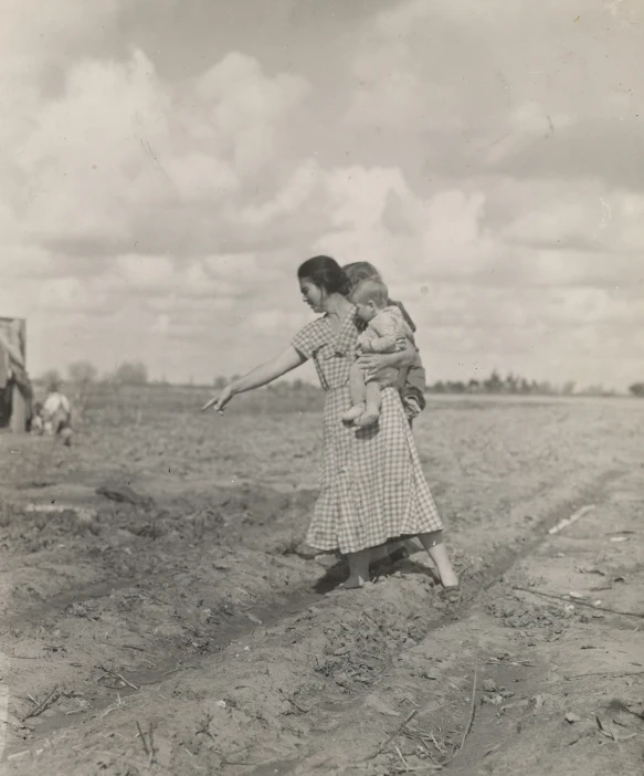 two girls are playing together in an open field