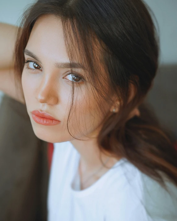 a close up of a person wearing a white shirt