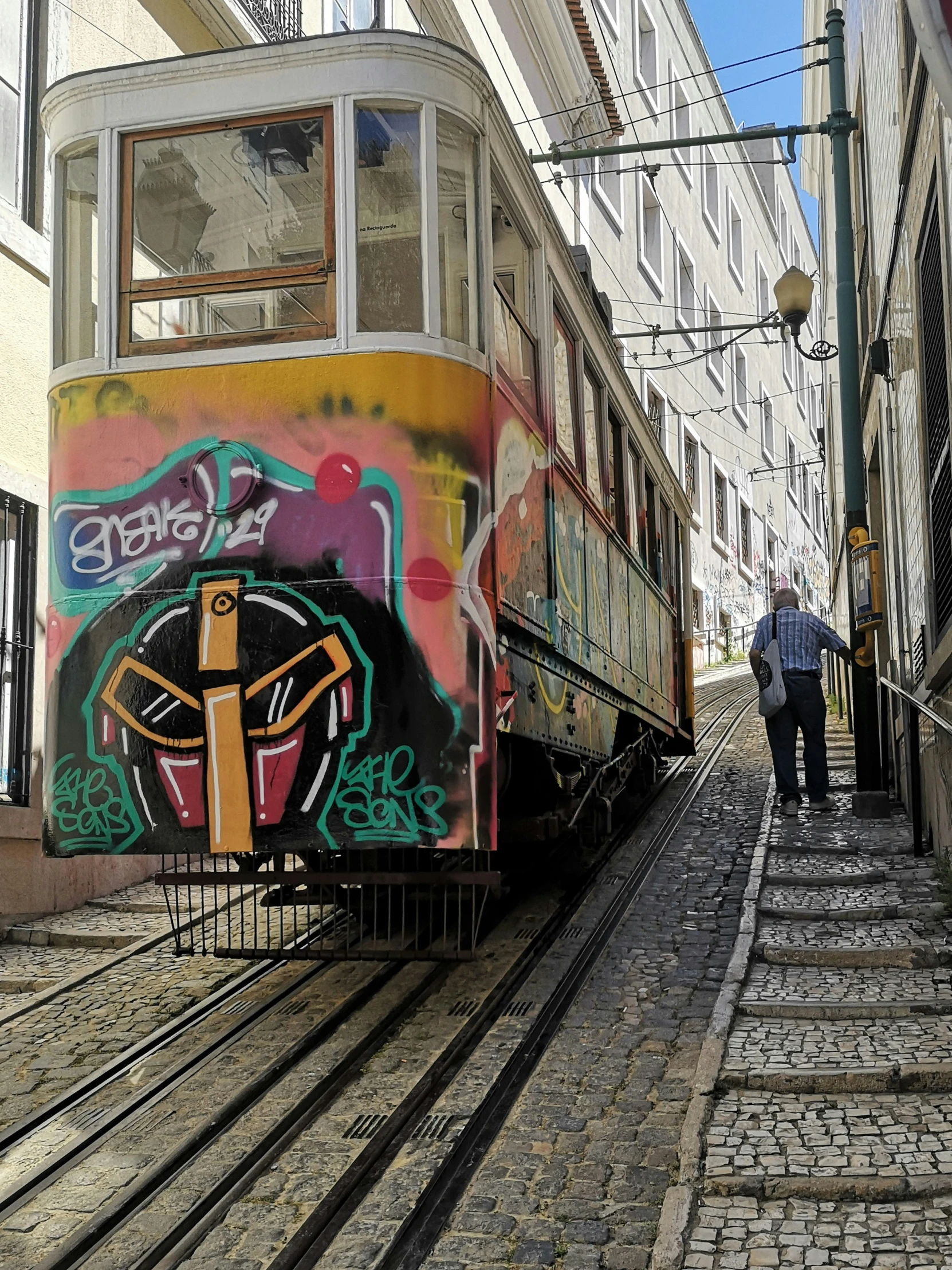 a train in the process of painting on the side