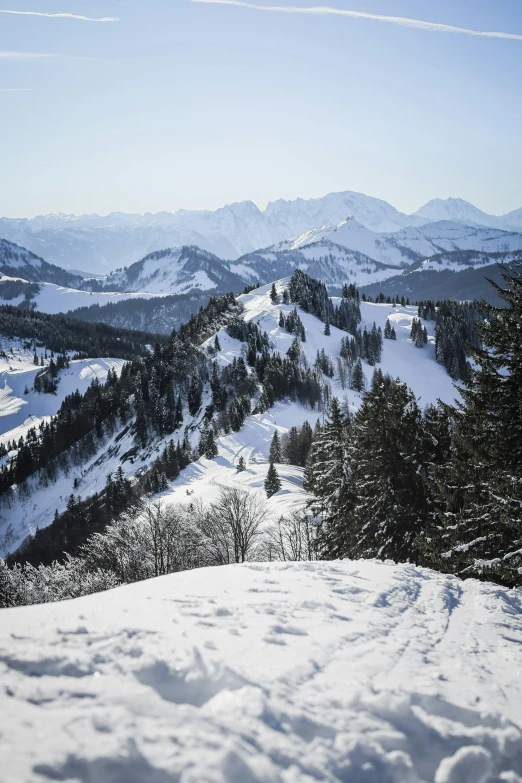 the view of a mountain covered in snow