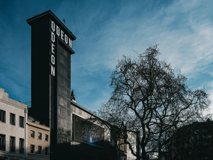 there is a tall clock tower that stands on the top of a building