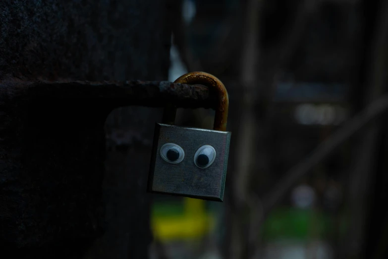 a padlock has eyes on it