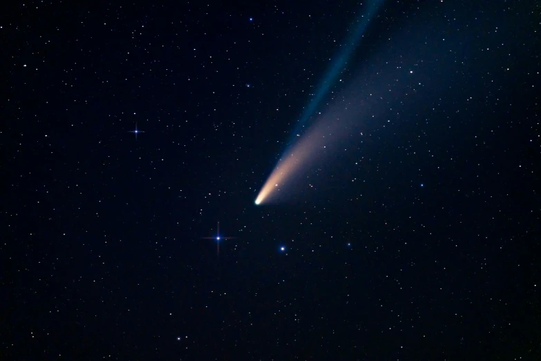 the long line between two stars shine brightly against a dark sky