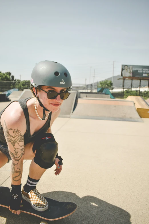 a female in a helmet is on her skateboard