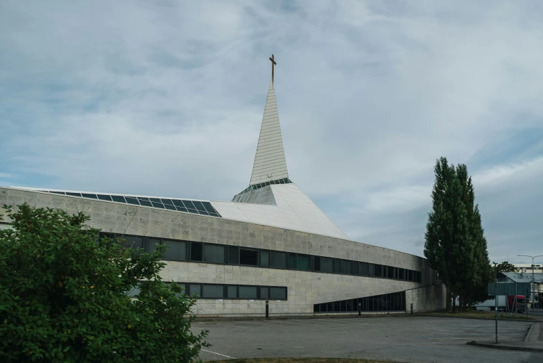 a building with a large triangular roof and large window