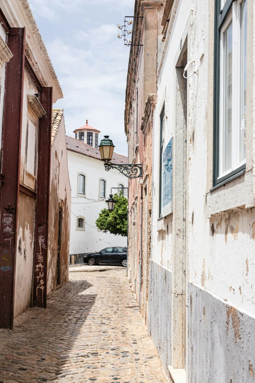 an old narrow cobbled street with old buildings