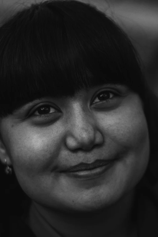 a close up of a person wearing a necklace