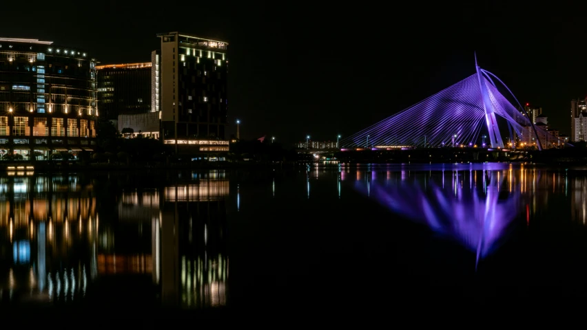 a view of some buildings in the distance at night