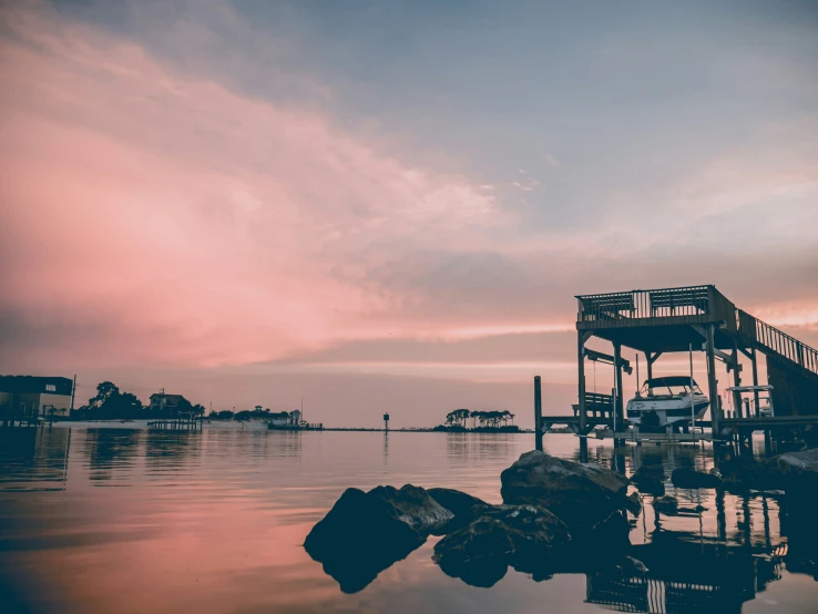 a truck is parked at the end of a dock