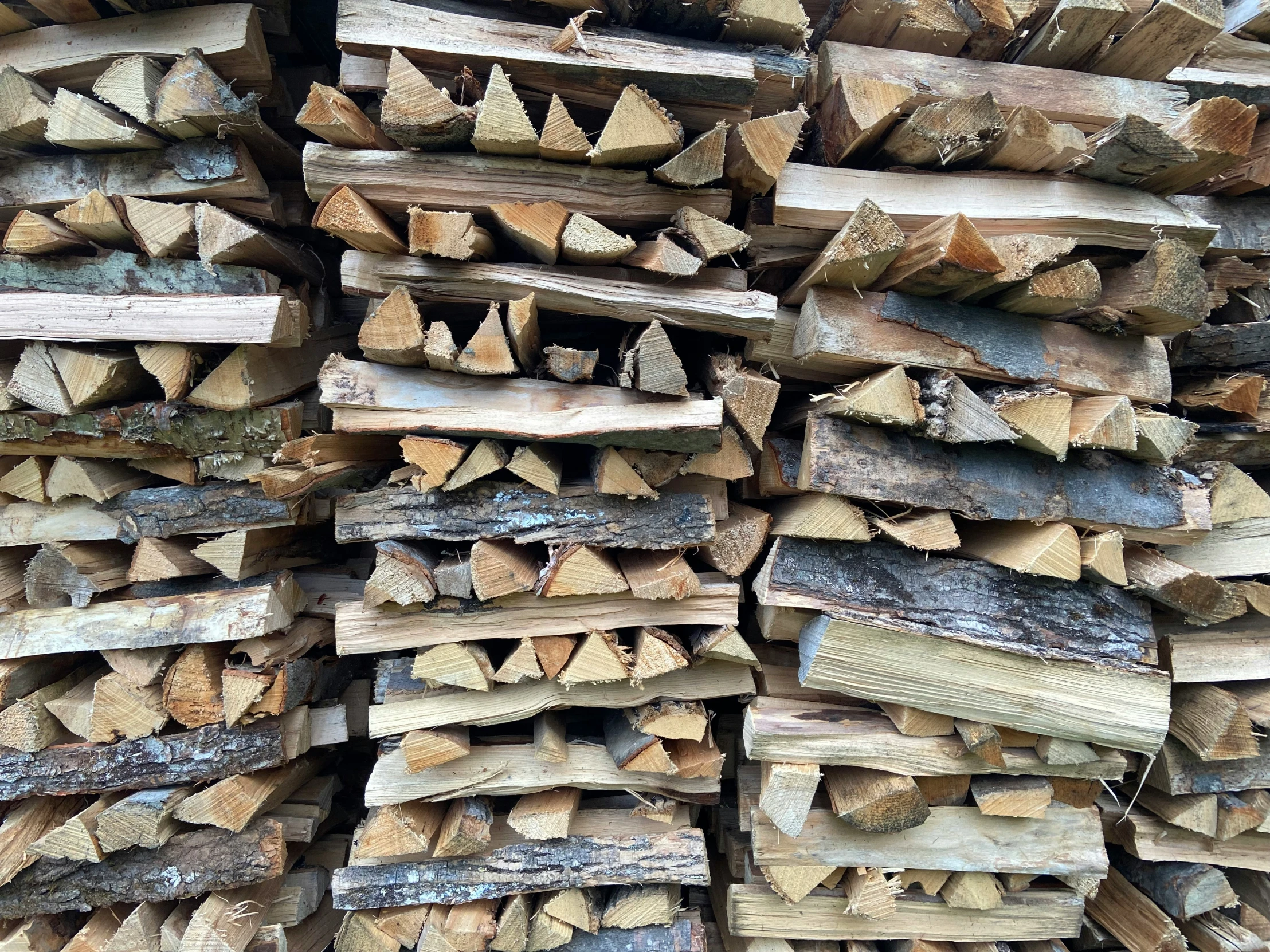 wooden logs stacked on top of each other