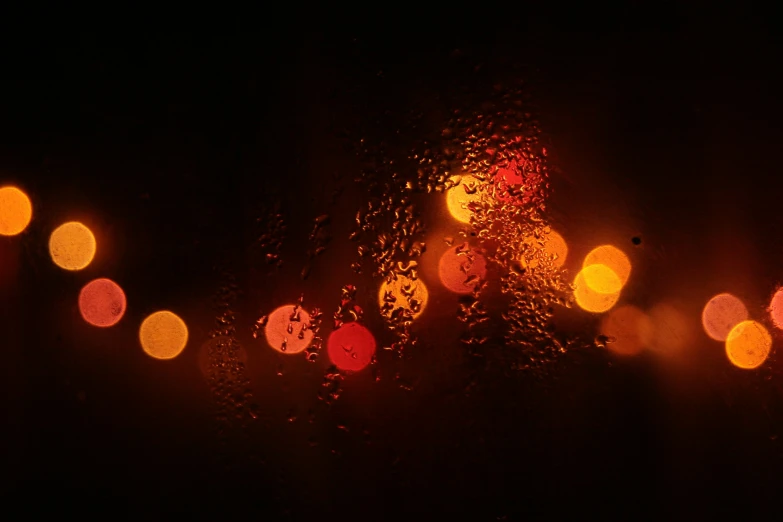 the view through a windshield showing various colored lights