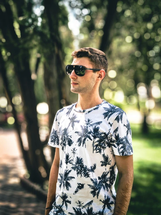 a man wearing sunglasses posing for a picture