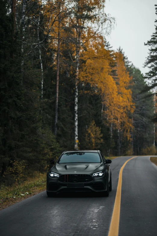 a bugatti coupe driving down the road