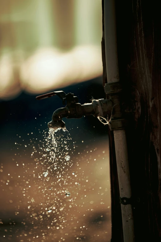 a faucet running out from a hose into a dle of water