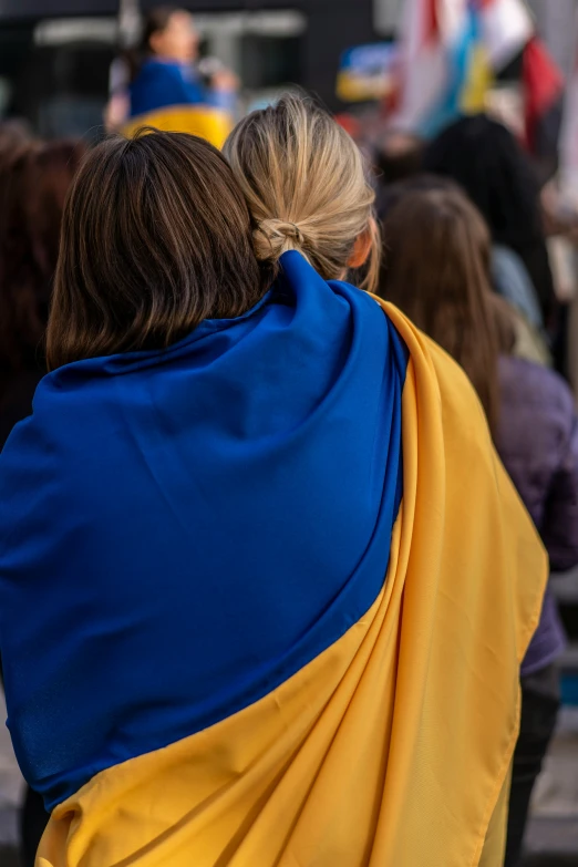 a woman with a yellow blue scarf is on her back