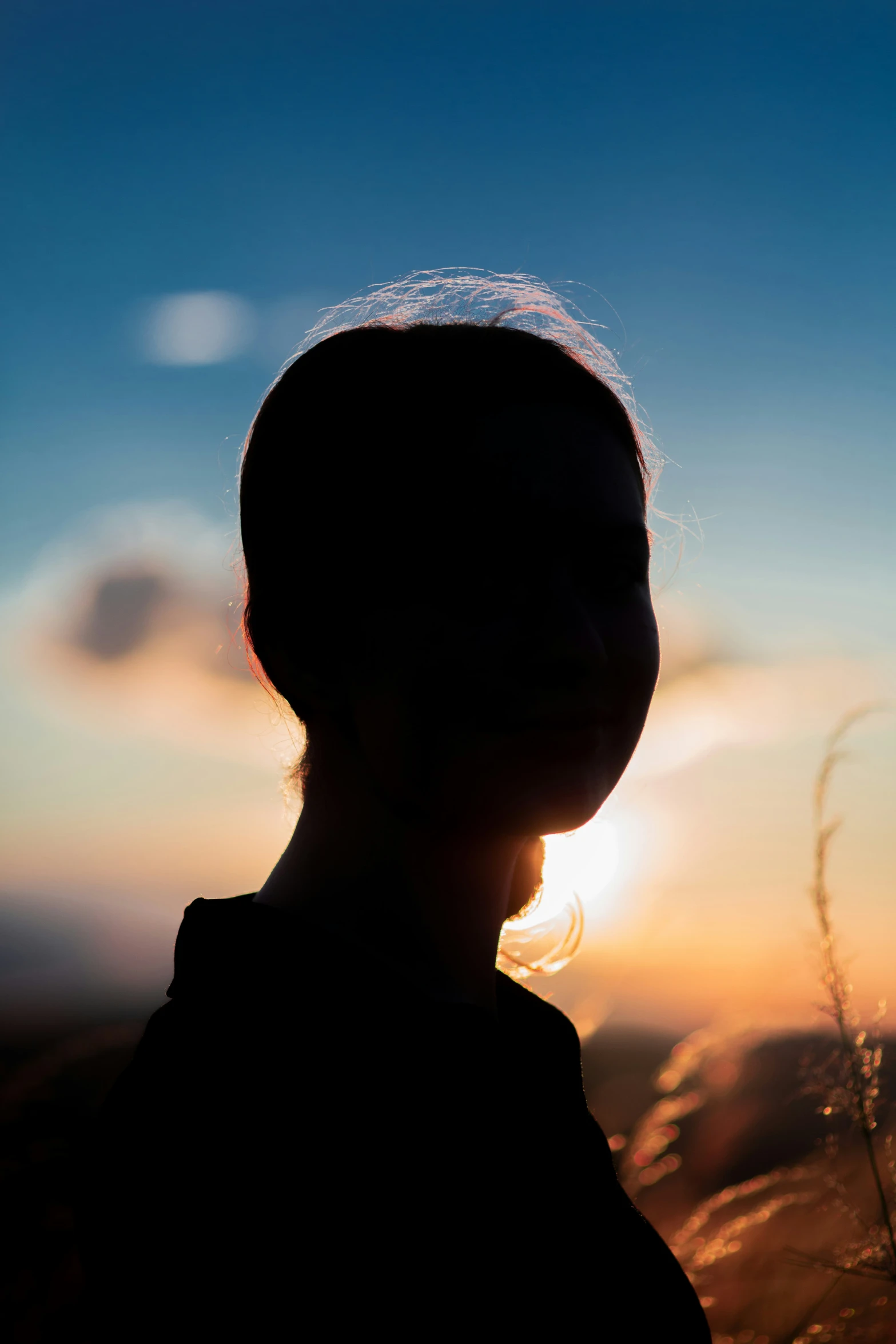 a profile s of a person with long hair