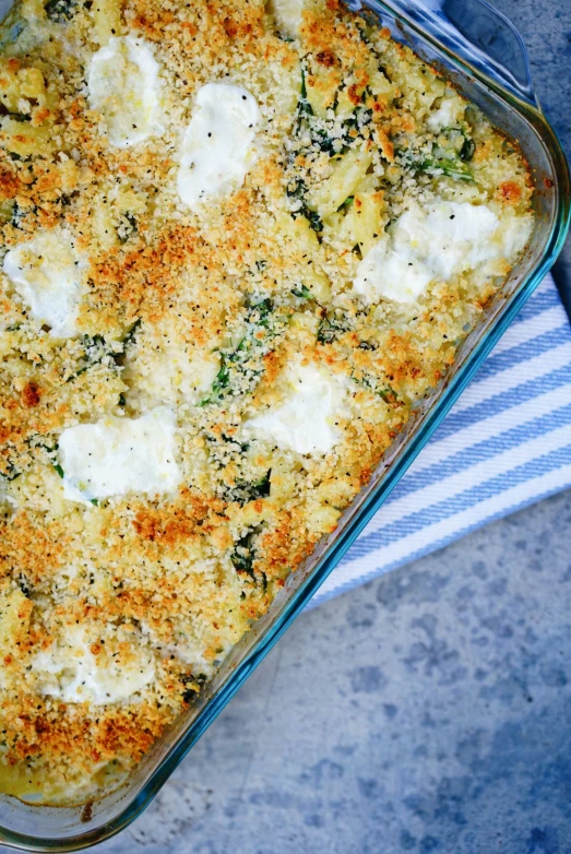 a casserole that has meat, cheese, and spinach on top