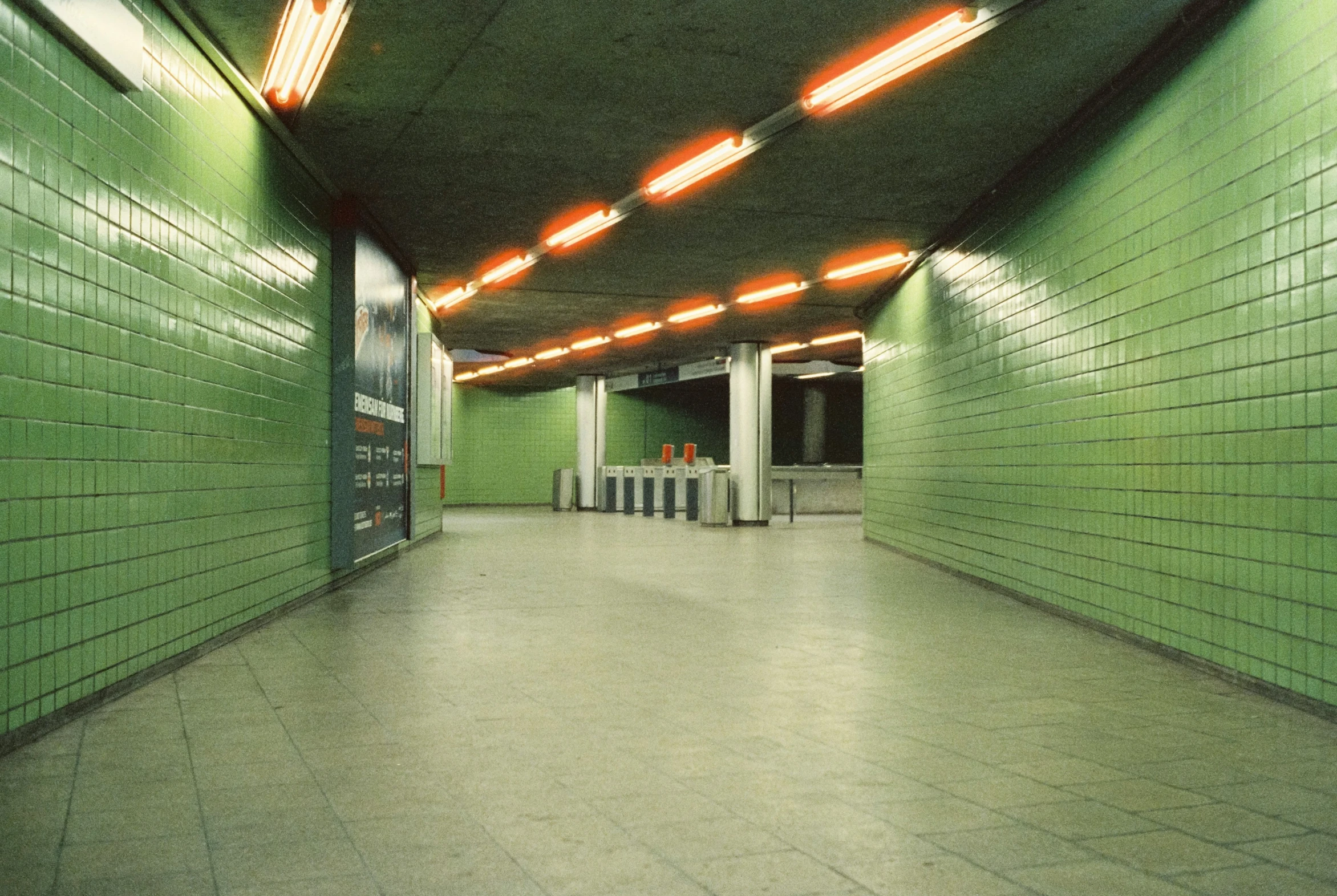 the hallway in the building is empty of people