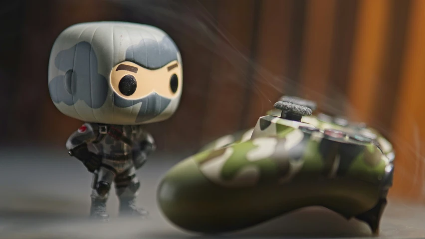 a small toy of a person with a helmet and camo shoes