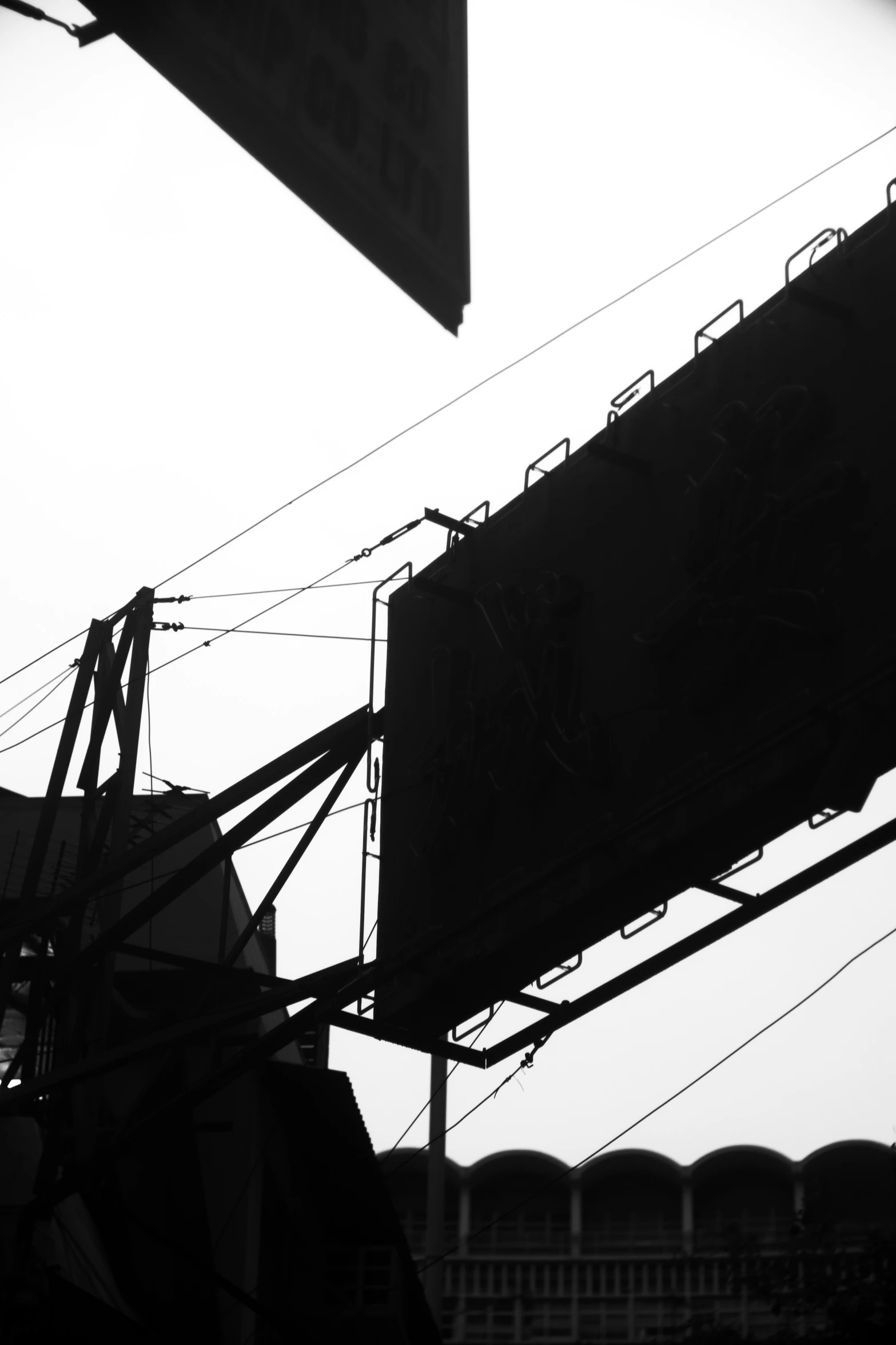 the image shows a view of city buildings in black and white