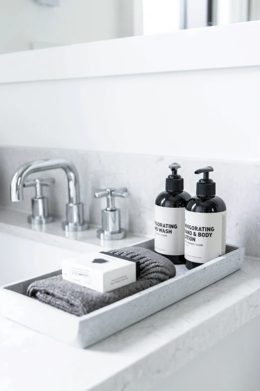 a white sink sitting next to a bathroom counter