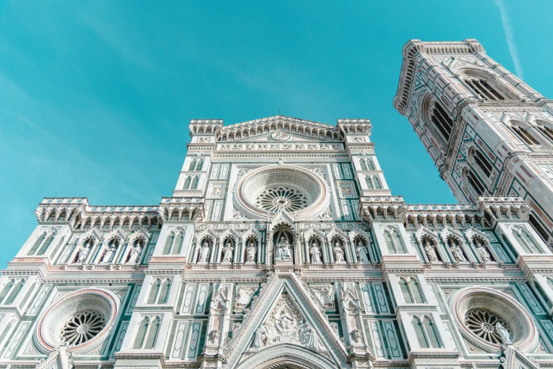 the cathedral has arched arches and is against the blue sky