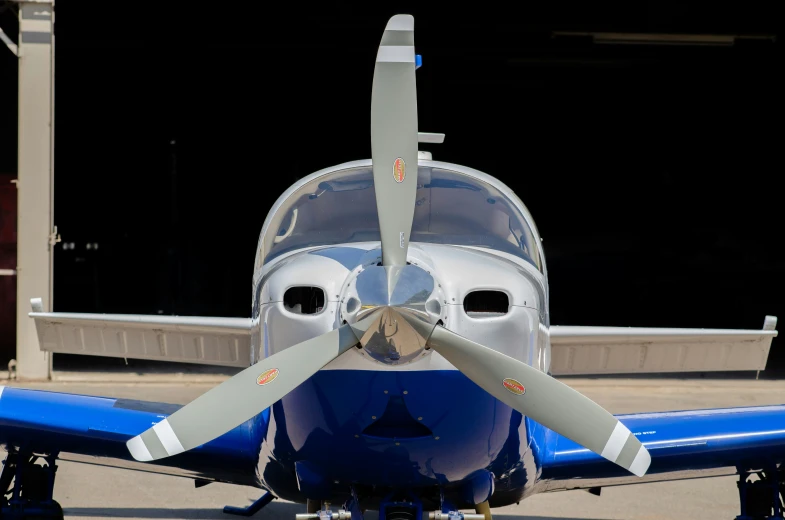 a single propeller airplane sitting on the tarmac