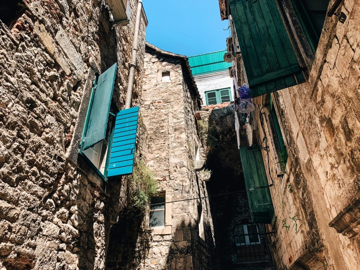the narrow streets in the old town have blue windows