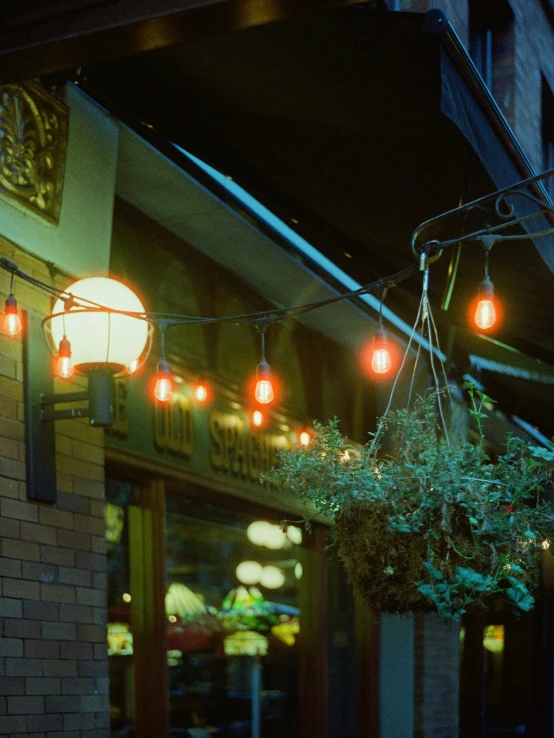 several lights hanging from a metal pole