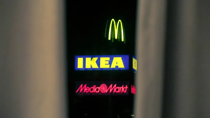 a neon sign at a mcdonalds restaurant lit up