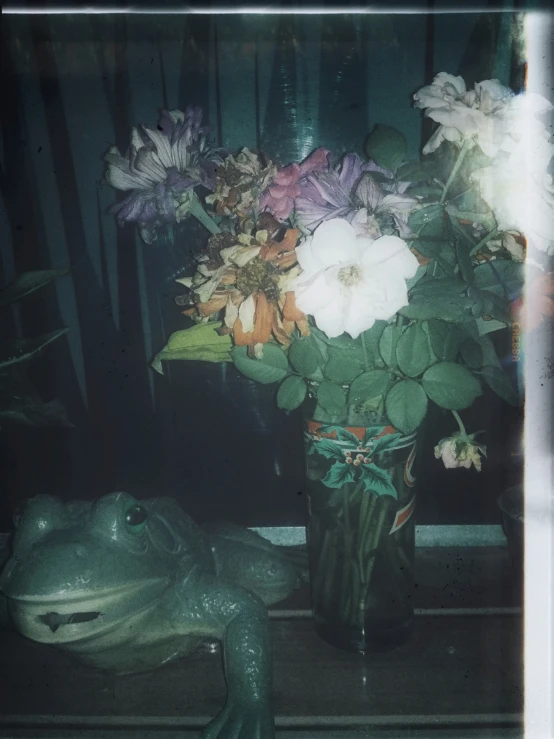 an artificial flower and leaf bouquet is displayed