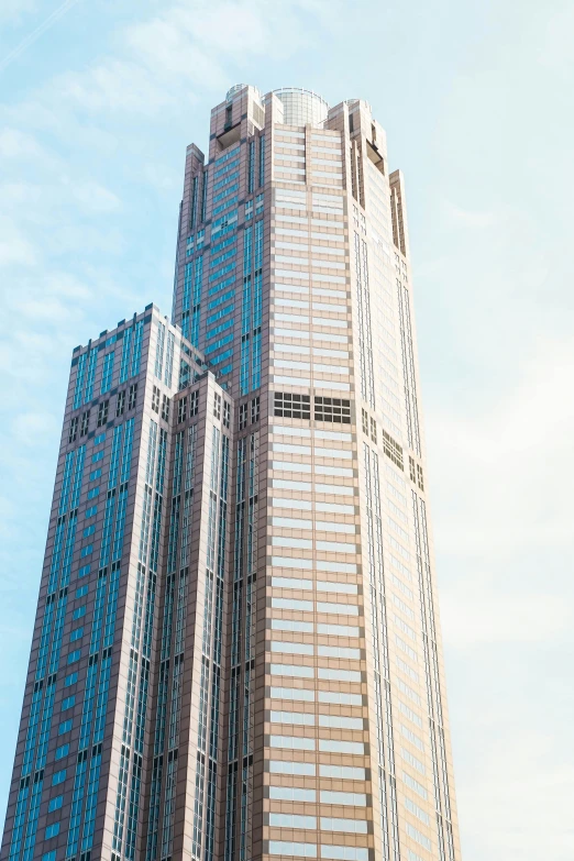 a large office building sitting in the middle of a blue sky