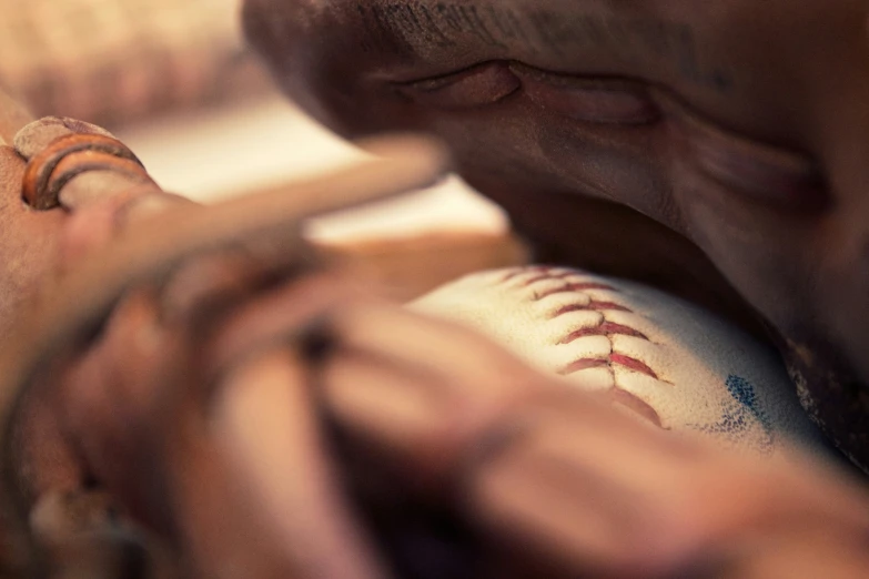 a man holding a baseball bat inside his hand