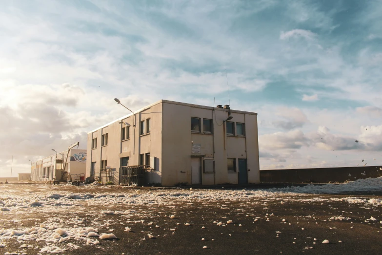 an old white building that has been knocked down