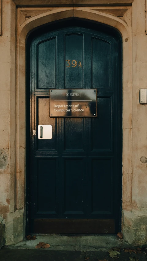 the doorway to the building is empty, it appears old