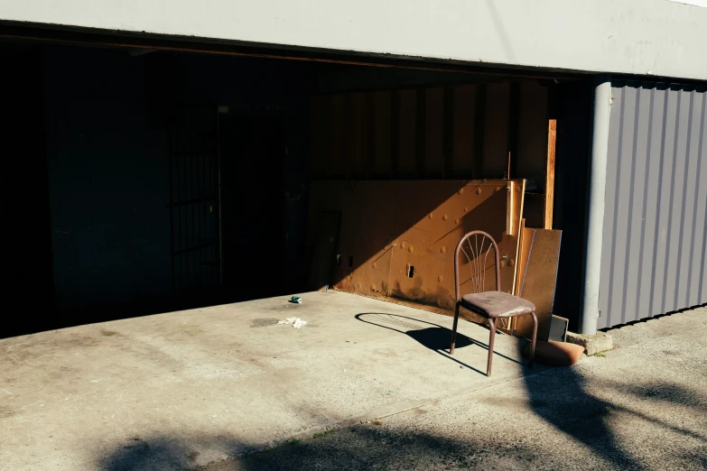 two chairs in front of an attached garage