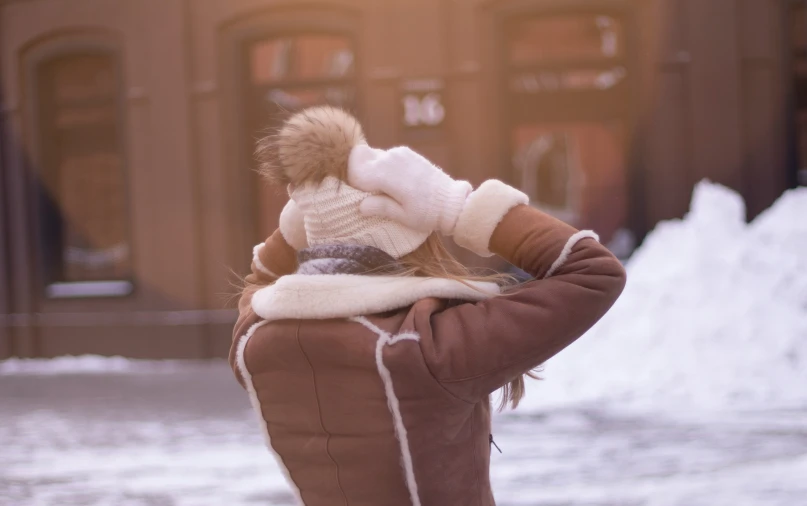 two children are wrapped in warm clothes outside