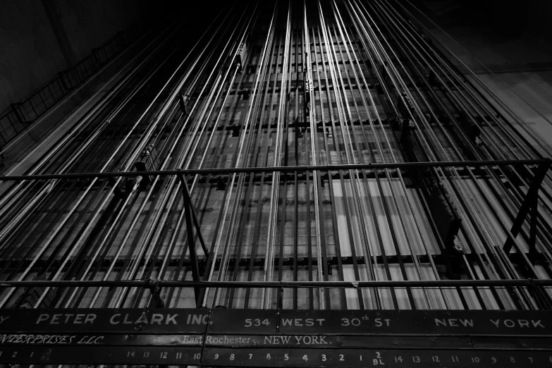 the structure of an unfinished building, in black and white