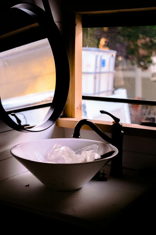 a large white bowl on a bathroom counter