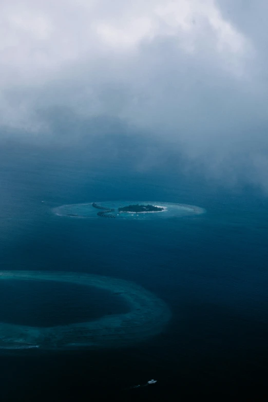 the water is so blue and calm that it looks like an island