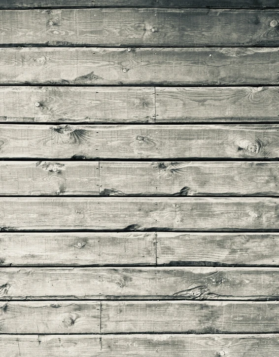 a black and white image of a wood board wall