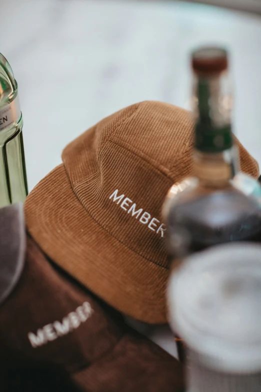 a brown hat and a bottle on a table