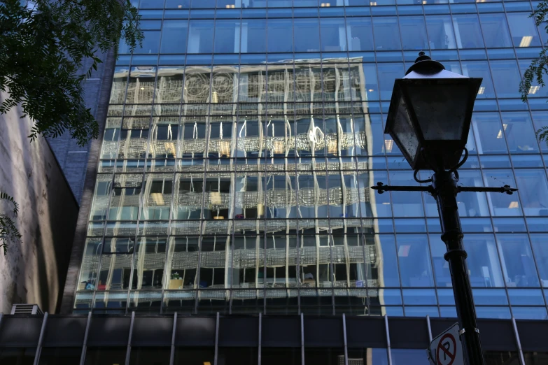 a street lamp with a building in the back ground