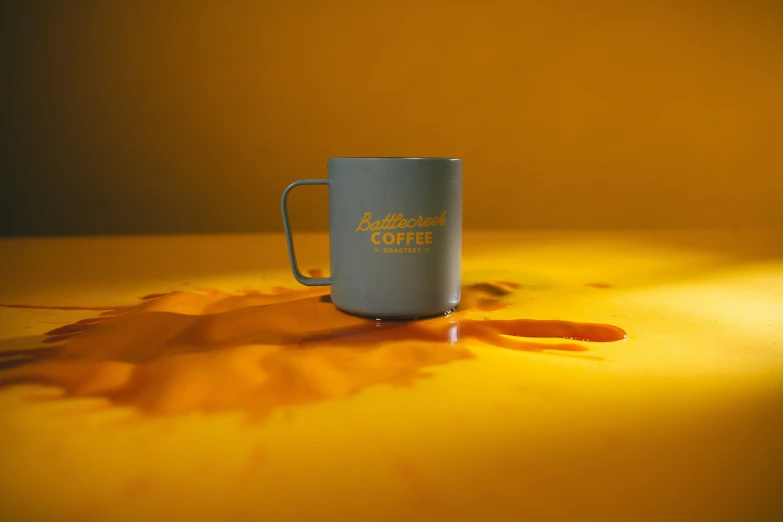 an empty coffee mug sits on a table